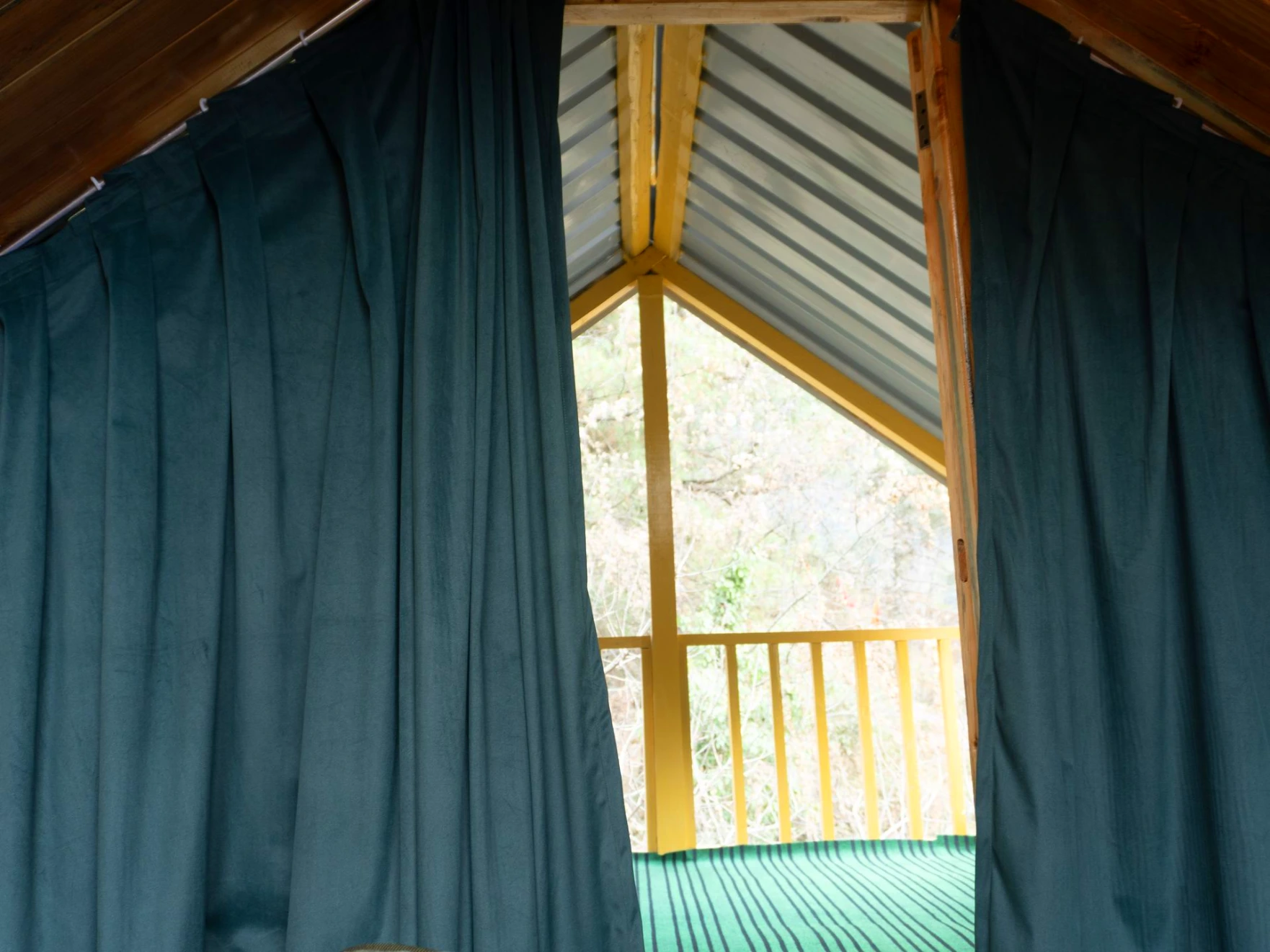 Balcony view surrounded by nature at The River Haven Homestay, Tirthan Valley