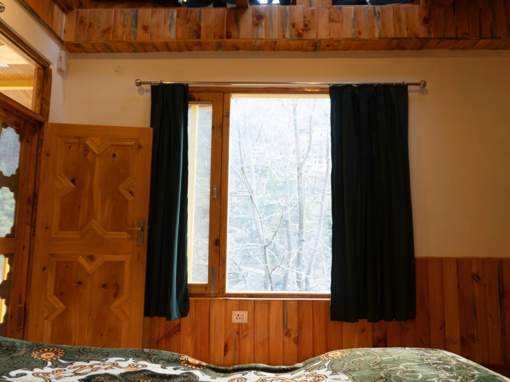 Balcony view surrounded by nature at The River Haven Homestay, Tirthan Valley