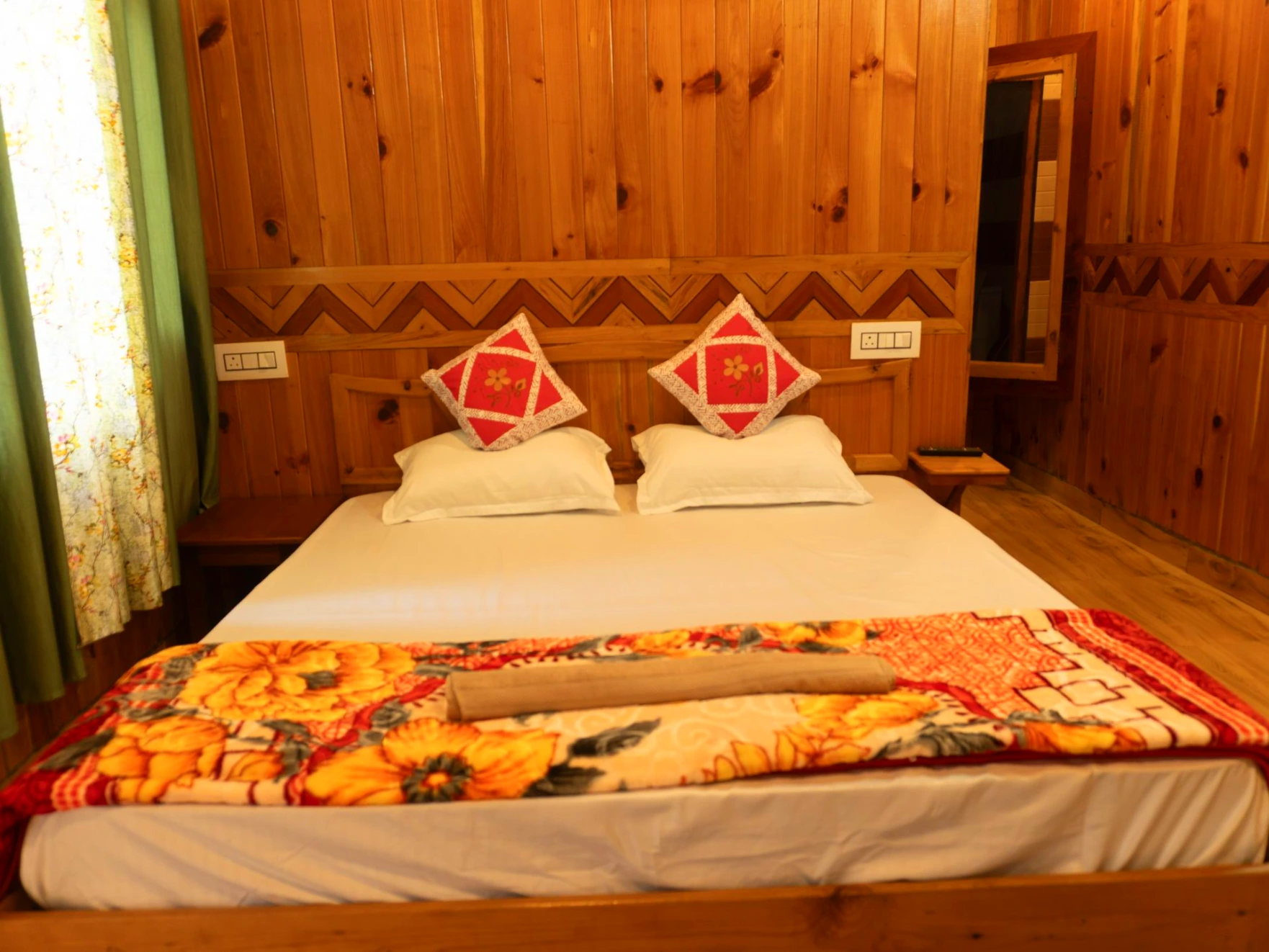 Comfortable bed with wooden interiors at The River Haven Homestay