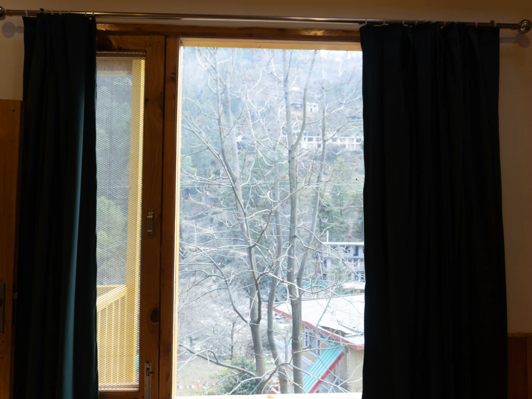Balcony view surrounded by nature at The River Haven Homestay, Tirthan Valley