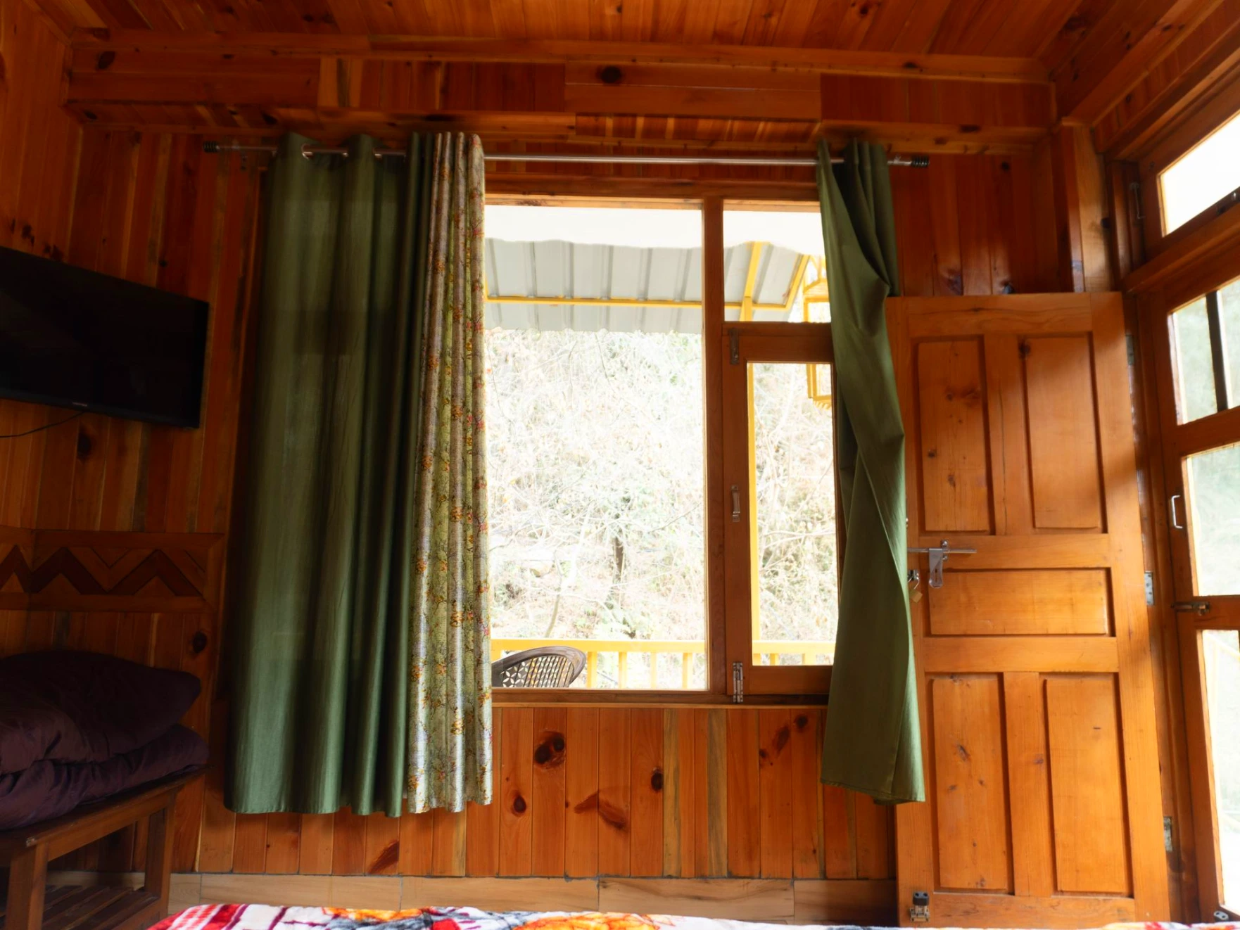 Balcony view surrounded by nature at The River Haven Homestay, Tirthan Valley