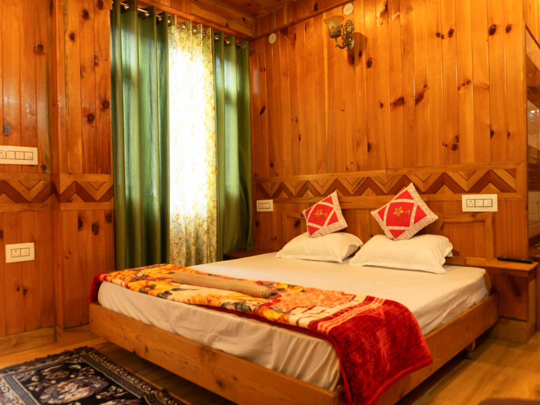 Comfortable bed with wooden interiors at The River Haven Homestay