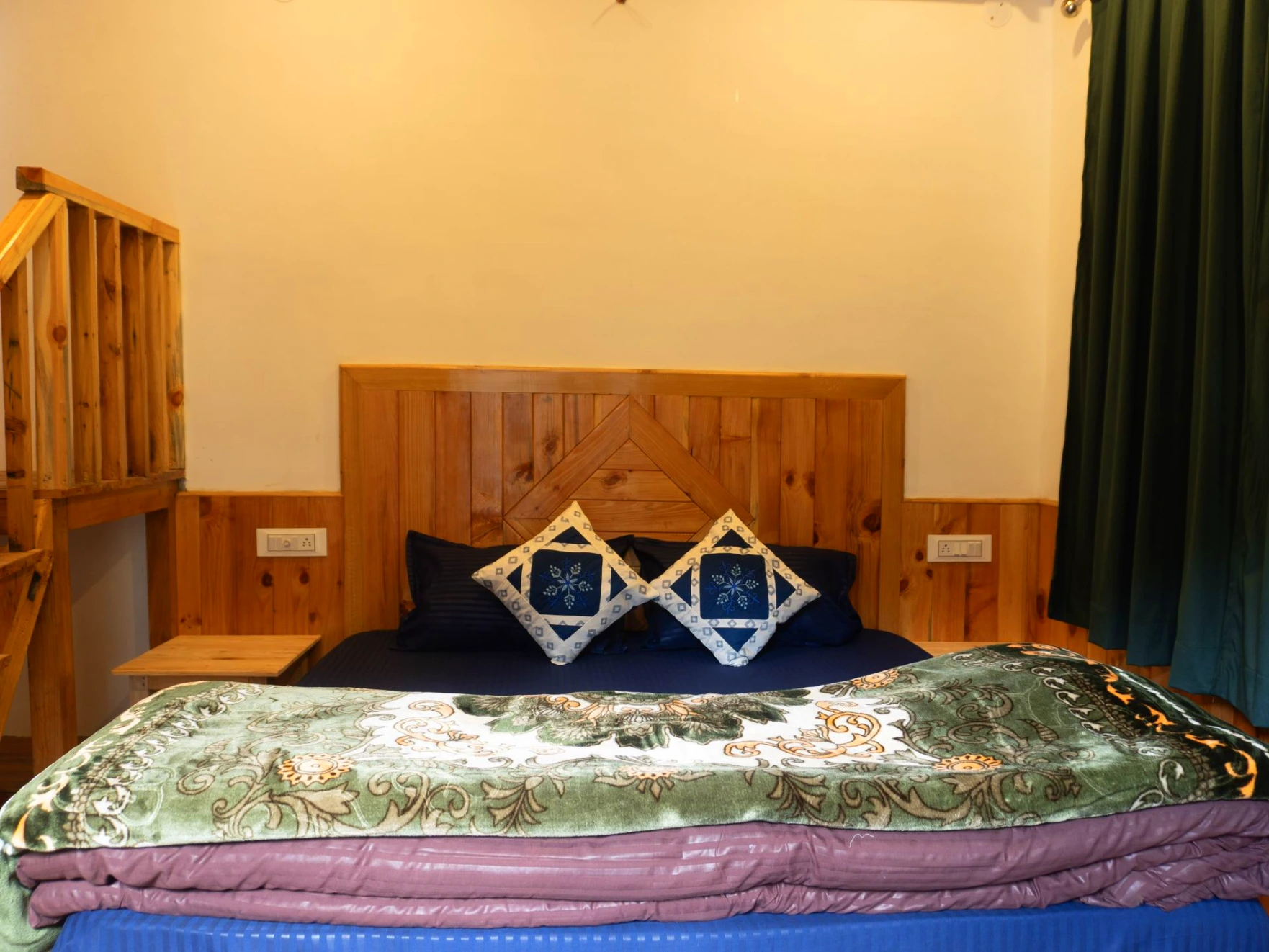 Comfortable bed with wooden interiors at The River Haven Homestay