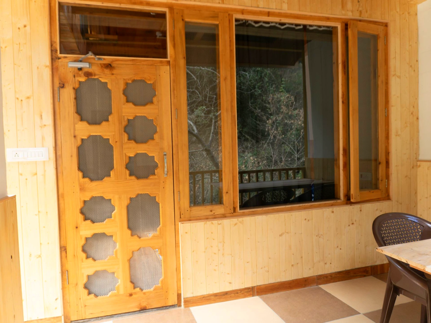 Balcony view surrounded by nature at The River Haven Homestay, Tirthan Valley