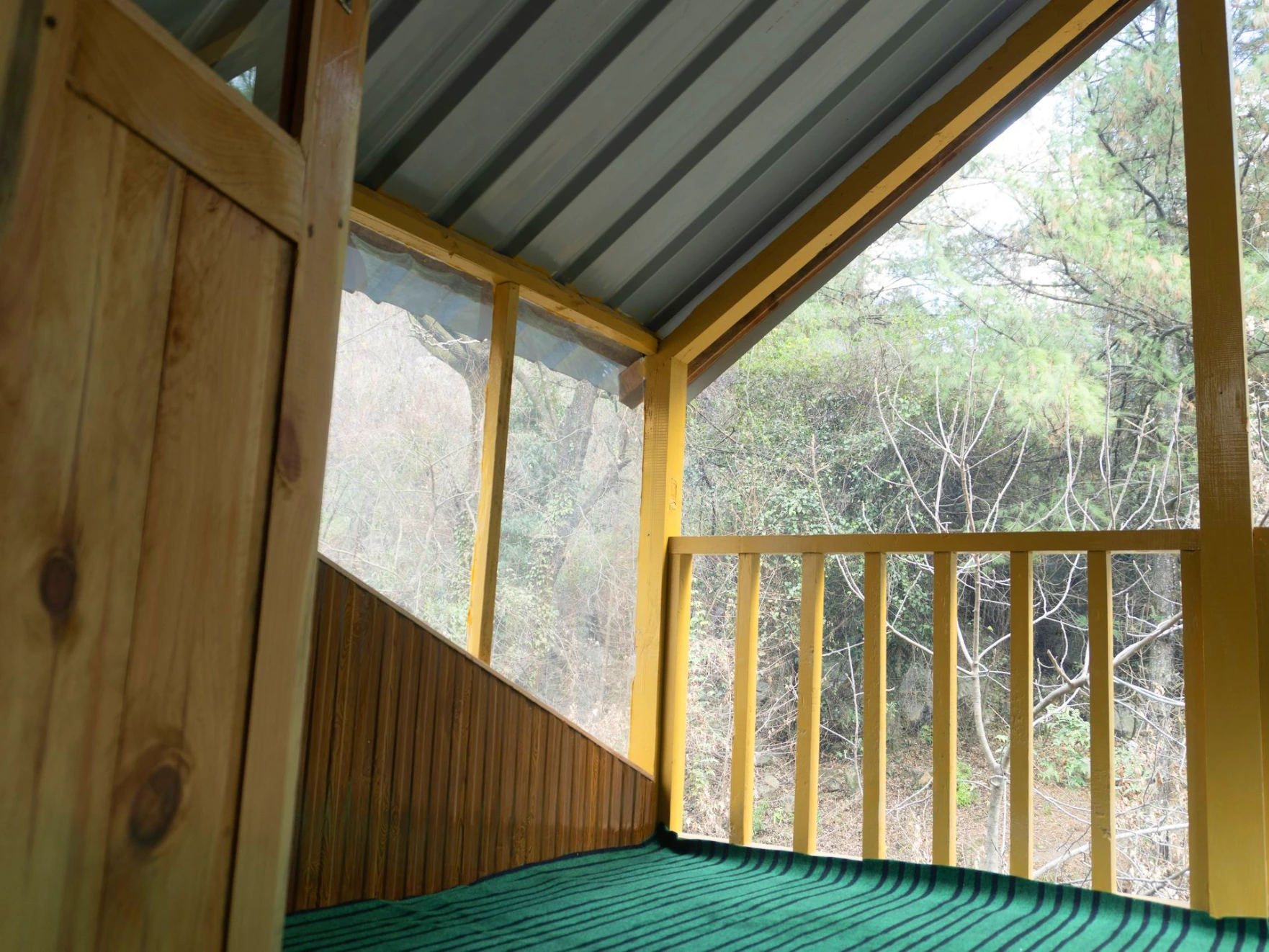 Balcony view surrounded by nature at The River Haven Homestay, Tirthan Valley