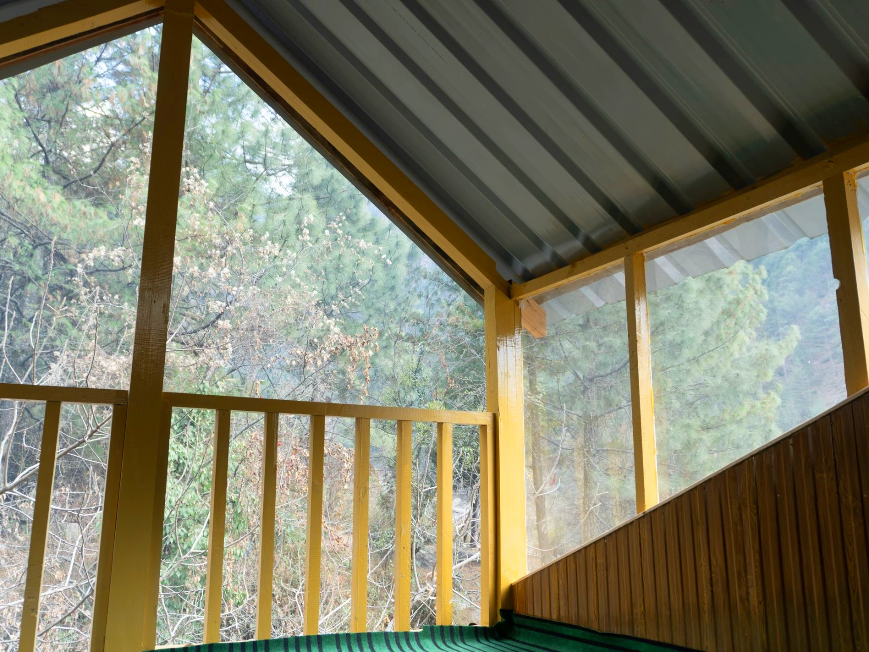 Balcony view surrounded by nature at The River Haven Homestay, Tirthan Valley