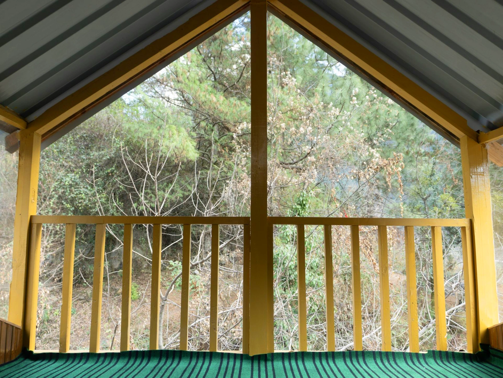 Balcony view surrounded by nature at The River Haven Homestay, Tirthan Valley